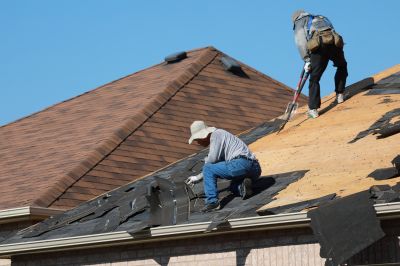 Professionals use specialized tools to remove old roofing materials efficiently, minimizing damage to the structure.